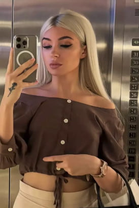 Young Russian blonde taking a selfie in a lift